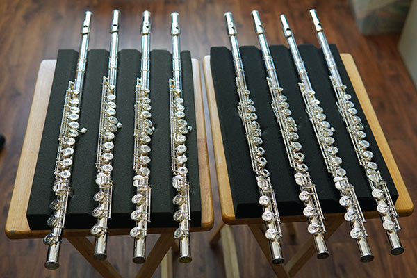 A selection of appropriate higher-level flutes presented to a student