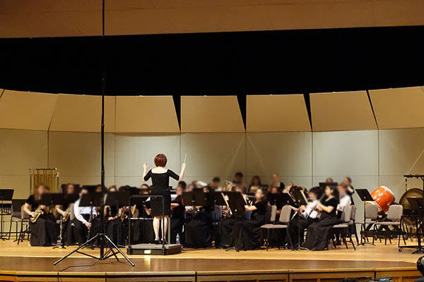 Emily Gurwitz directing/clinicing a concert band